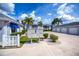Exterior of condo buildings featuring mailboxes, garages, and well-maintained landscaping at 1340 San Cristobal Ave # 305, Punta Gorda, FL 33983