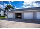 Condo garages with car parked inside, offering convenient parking at 1340 San Cristobal Ave # 305, Punta Gorda, FL 33983