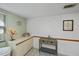 Bright hallway featuring built-in cabinets, decorative accents, and neutral tones creating a welcoming space at 1340 San Cristobal Ave # 305, Punta Gorda, FL 33983