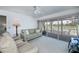 Bright living space with serene golf course views and screened lanai access offering a tranquil retreat at 1340 San Cristobal Ave # 305, Punta Gorda, FL 33983