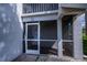 Screened-in front porch with tiled flooring and a view of the outdoors at 1340 San Cristobal Ave # 305, Punta Gorda, FL 33983