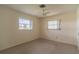 Bedroom with natural light, featuring two windows offering exterior views at 1345 Cambridge Dr, Venice, FL 34293