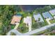 Aerial view of several homes with pools and well-manicured lawns in a residential neighborhood at 14455 Silver Lakes Cir, Port Charlotte, FL 33953