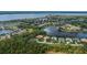 An aerial view showcases the community with its multiple ponds and lush landscapes at 14455 Silver Lakes Cir, Port Charlotte, FL 33953
