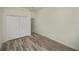 The bedroom features a closet with white bi-fold doors and light wood-look flooring at 14455 Silver Lakes Cir, Port Charlotte, FL 33953