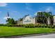Community entrance sign surrounded by lush landscaping and greenery at 14455 Silver Lakes Cir, Port Charlotte, FL 33953