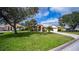 Beautiful home featuring lush landscaping and a well-maintained lawn at 14455 Silver Lakes Cir, Port Charlotte, FL 33953