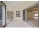 Open patio with sliding glass doors and views of the lake and backyard at 14455 Silver Lakes Cir, Port Charlotte, FL 33953