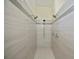 Walk-in shower with dual shower heads and white tiled walls at 14455 Silver Lakes Cir, Port Charlotte, FL 33953