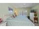 Spacious bedroom with bright light from plantation shutters and views of the community at 19335 Water Oak Dr # 202, Port Charlotte, FL 33948