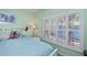 Bedroom features plantation shutters providing natural light and privacy at 19335 Water Oak Dr # 202, Port Charlotte, FL 33948