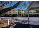 Condo exterior with covered parking, tropical landscaping, and freshly painted exterior at 19335 Water Oak Dr # 202, Port Charlotte, FL 33948