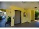 A convenient elevator provides easy access, with a bench, tropical plants, and bulletin board nearby at 19335 Water Oak Dr # 202, Port Charlotte, FL 33948