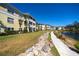 Beautiful multi-story condo buildings with lake views, manicured lawns and lakeside walking path at 19335 Water Oak Dr # 202, Port Charlotte, FL 33948