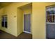 Exterior view of condo entrance, number 202, with secure screen door and large windows at 19335 Water Oak Dr # 202, Port Charlotte, FL 33948