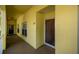 Exterior view of condo entrance with a secure door and bright natural light at 19335 Water Oak Dr # 202, Port Charlotte, FL 33948