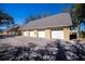 Individual garages offer private parking, with a clean and well-maintained exterior at 19335 Water Oak Dr # 202, Port Charlotte, FL 33948