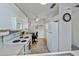 Bright kitchen featuring white appliances, a ceiling fan, and a dedicated workspace for added convenience at 19335 Water Oak Dr # 202, Port Charlotte, FL 33948