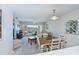 Inviting living space with a dining area, comfortable seating, and a view of the screened patio at 19335 Water Oak Dr # 202, Port Charlotte, FL 33948