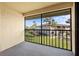 Screened balcony overlooking well-maintained grounds, offering a peaceful outdoor retreat at 19505 Quesada Ave # Ee204, Port Charlotte, FL 33948