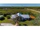 Aerial view of the house situated in a large lot with well-maintained landscaping at 29175 River Dr, Punta Gorda, FL 33982