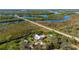 High aerial view of property showcasing water access and lush green surroundings at 29175 River Dr, Punta Gorda, FL 33982