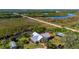 Bird's eye view of home featuring metal roof, nestled amidst serene natural surroundings near the river at 29175 River Dr, Punta Gorda, FL 33982