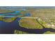 Waterfront acreage with a beautiful property offers privacy and scenic views at 29175 River Dr, Punta Gorda, FL 33982