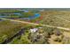 Scenic aerial view of the home, showcasing water frontage and natural surroundings at 29175 River Dr, Punta Gorda, FL 33982