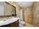 Bathroom with a large vanity, shower, and stone tile at 29175 River Dr, Punta Gorda, FL 33982