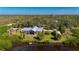 Lovely home features a metal roof and lush landscaping offering privacy and tranquility at 29175 River Dr, Punta Gorda, FL 33982