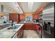 Well-equipped kitchen featuring granite countertops, stainless steel appliances, and ample cabinet space at 29175 River Dr, Punta Gorda, FL 33982