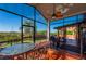 Outdoor patio with seating, a BBQ grill, and lush green views at 29175 River Dr, Punta Gorda, FL 33982