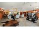 Bright living room featuring high vaulted ceilings, large windows, tile flooring, and ample space at 29175 River Dr, Punta Gorda, FL 33982