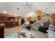 Open-concept living room featuring high ceilings, tile flooring, and access to the outdoor living space at 29175 River Dr, Punta Gorda, FL 33982