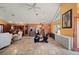Spacious living room featuring high ceilings, a tile floor, and an open layout into the kitchen and dining areas at 29175 River Dr, Punta Gorda, FL 33982
