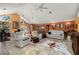 Open living room featuring tile floors, orange walls, and lots of natural light at 29175 River Dr, Punta Gorda, FL 33982