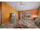 Main bedroom featuring tile floors and a sliding door at 29175 River Dr, Punta Gorda, FL 33982