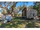 Large storage shed with weathered wood exterior in the backyard at 29175 River Dr, Punta Gorda, FL 33982