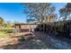 Spacious weathered wood outbuilding with shaded areas on the property at 29175 River Dr, Punta Gorda, FL 33982