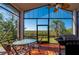 Relaxing screened-in patio with comfortable seating, perfect for outdoor dining and entertaining at 29175 River Dr, Punta Gorda, FL 33982