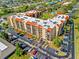 Aerial view of the community featuring tennis courts and a pool at 3006 Caring Way # 431, Port Charlotte, FL 33952