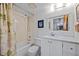 Clean bathroom with a tub-shower combo, white vanity, and neutral tones, creating a relaxing atmosphere at 3006 Caring Way # 431, Port Charlotte, FL 33952