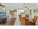 Cozy dining area with wicker chairs and views into the living room and kitchen at 3006 Caring Way # 431, Port Charlotte, FL 33952