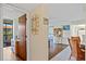 Inviting hallway showcases a decorative mirror and leads to the comfortable living spaces and bright bedrooms at 3006 Caring Way # 431, Port Charlotte, FL 33952