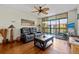 Living room featuring a sliding glass door to the balcony and comfortable seating at 3006 Caring Way # 431, Port Charlotte, FL 33952