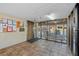 Well-lit lobby area with tiled floors, bulletin boards, seating, and an elevator for easy access at 3006 Caring Way # 431, Port Charlotte, FL 33952