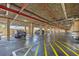 Secure parking garage featuring designated parking spaces and ample lighting for residents and visitors at 3006 Caring Way # 431, Port Charlotte, FL 33952
