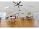 Spacious recreation room with tables, chairs, ceiling fans, and a television for community gatherings at 3006 Caring Way # 431, Port Charlotte, FL 33952