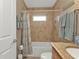 The bathroom features a shower and bath with tile backsplash and granite countertop at 3080 Belleville Ter, North Port, FL 34286